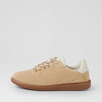 A low-top sneaker in beige suede and mesh with a brown gum sole, beige laces, and a cream collar, shown from a side profile on a light gray background.