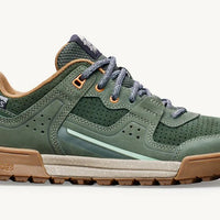 Green hiking shoe with brown sole on a white background