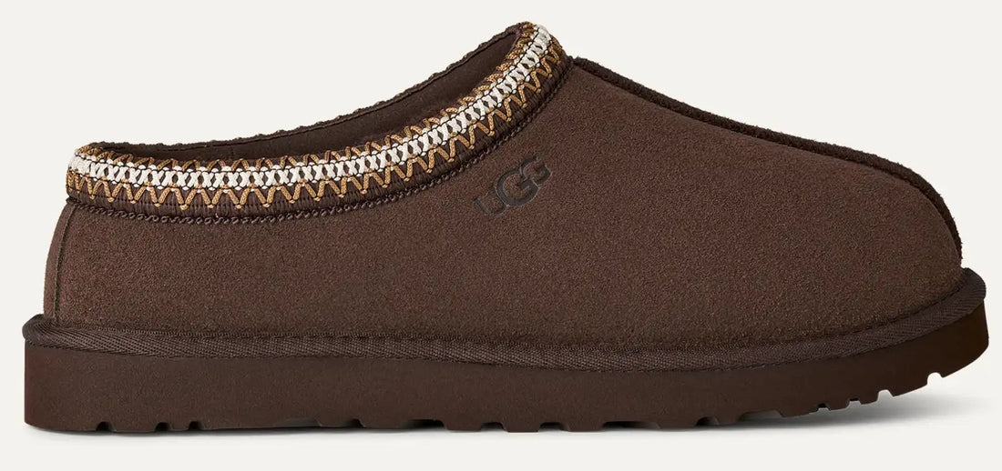 Brown slipper with a decorative trim on a white background