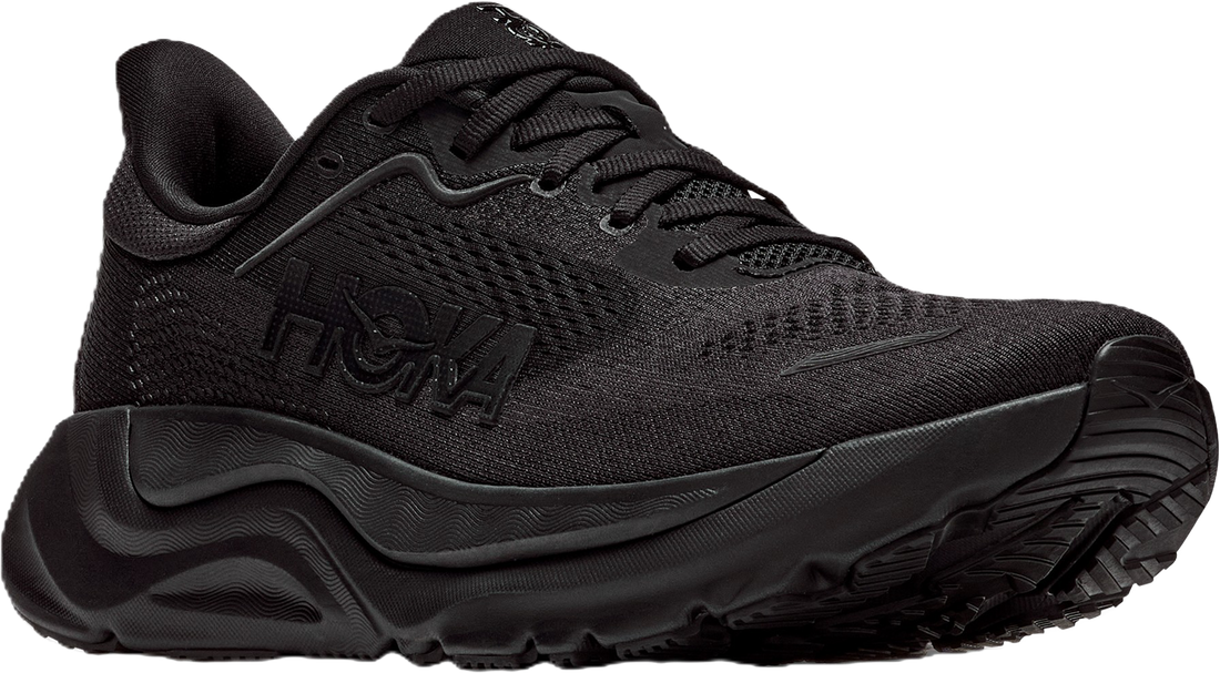 A black Hoka trail running shoe with a textured mesh upper, black laces, and a chunky black midsole and outsole, shown on a plain white background.
